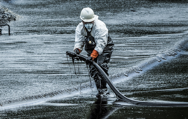 oil cleanup worker from environmental services company